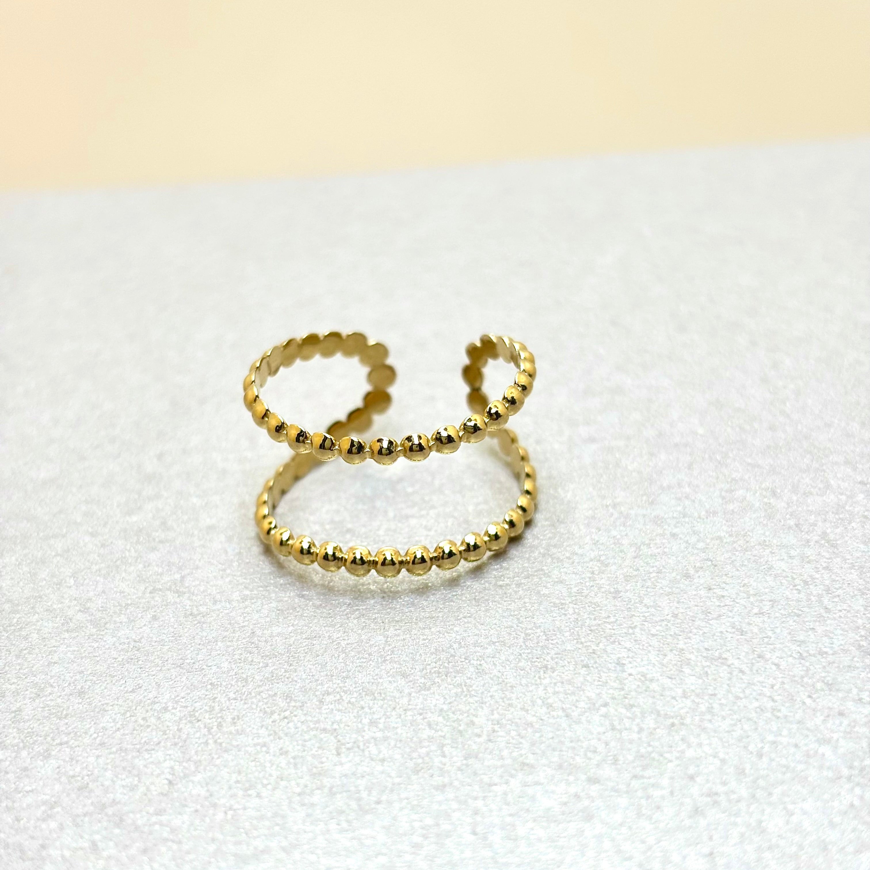 Bague en acier doré femme double rang effet contour perlé