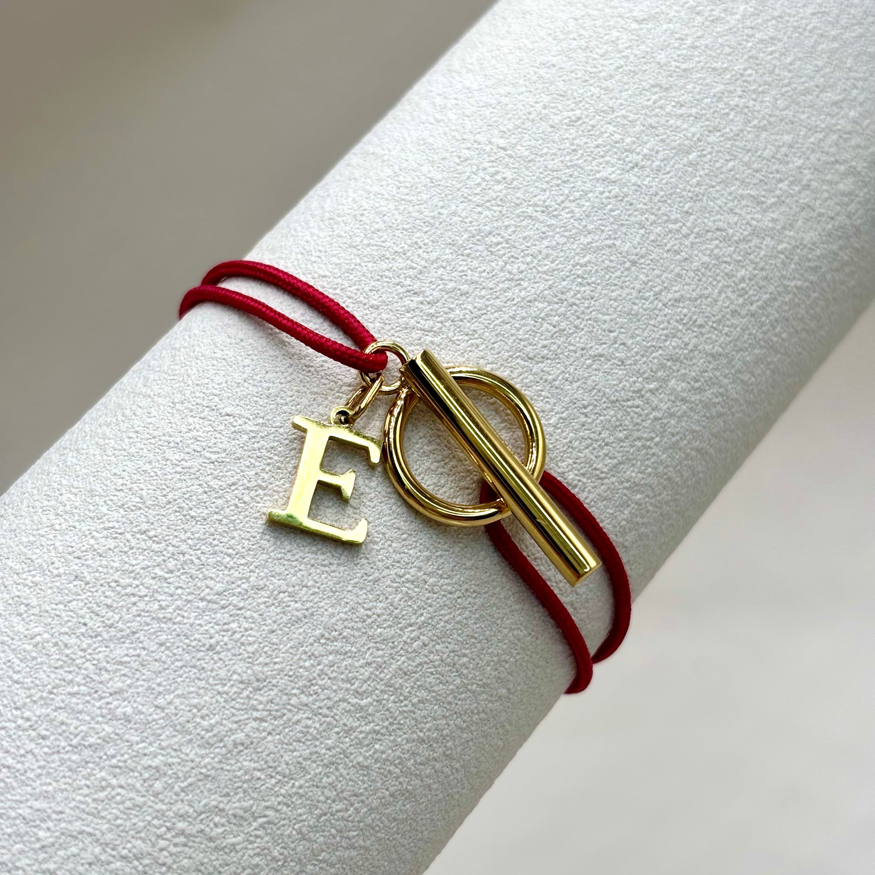 Bracelet cordon nylon tressé rouge et fermoir Toggle lettre en acier inoxydable dore à l'or in