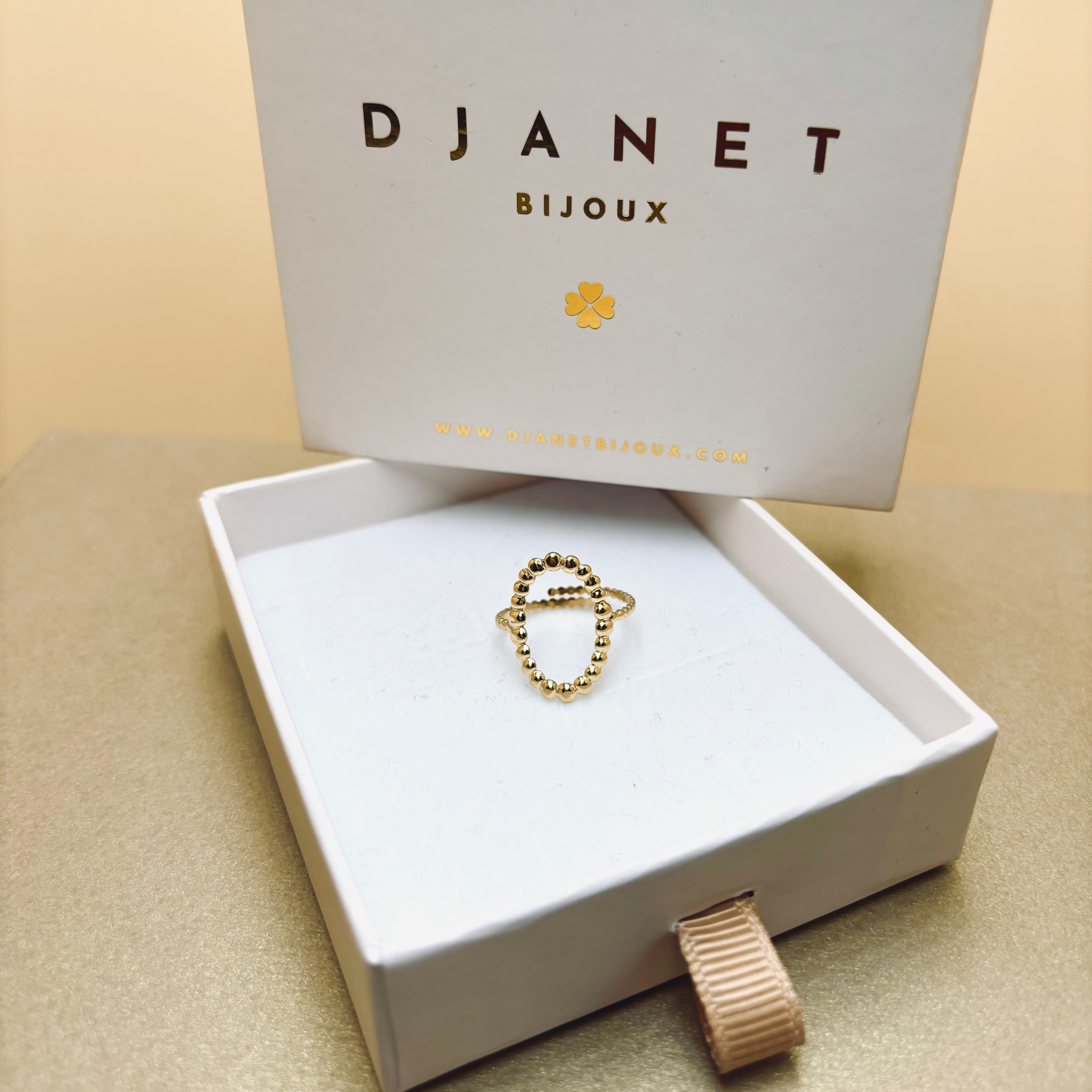 Bague acier inoxydable dore forme ovale contour petites billes