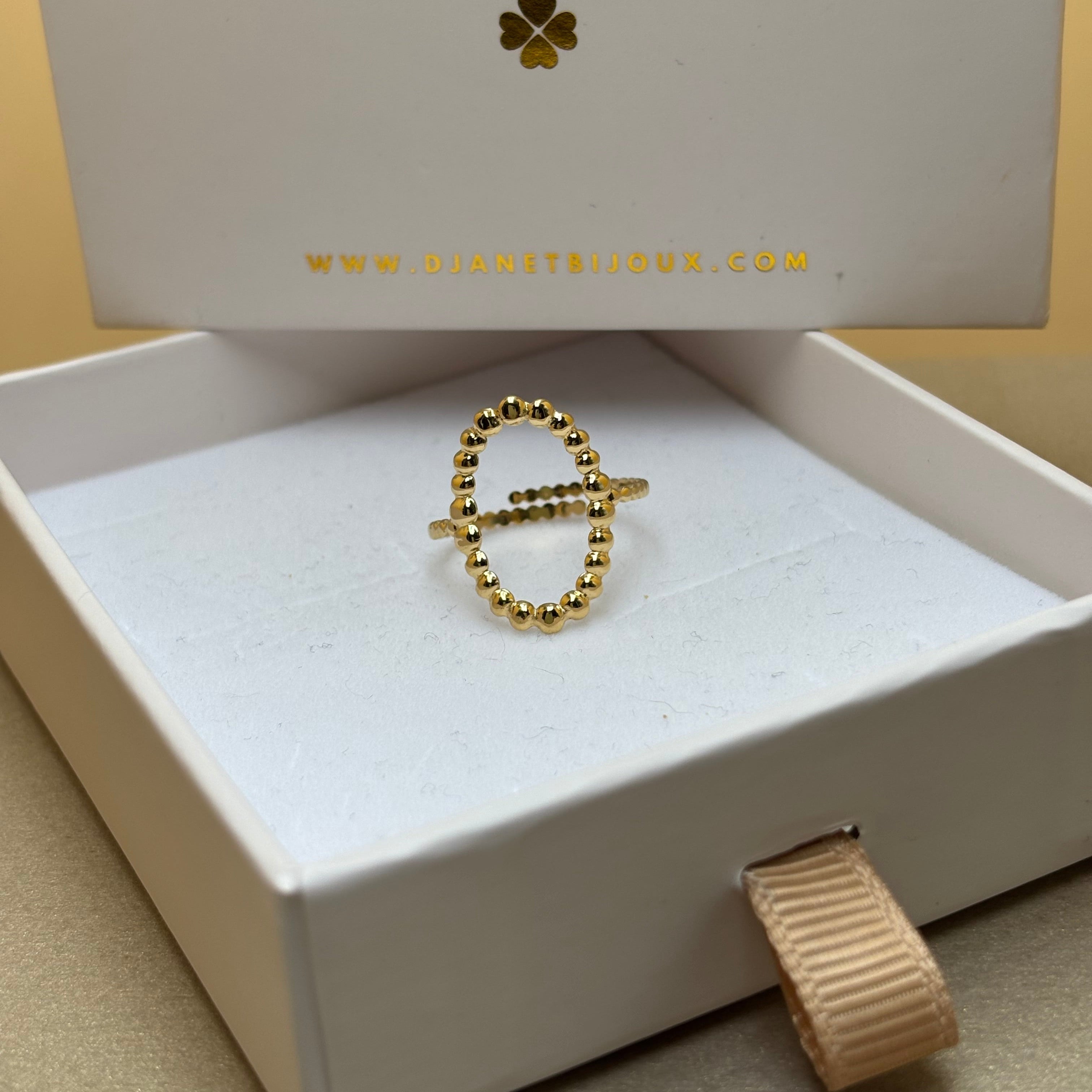 Bague femme en acier doré forme ovale effet petites billes anneau ajustable